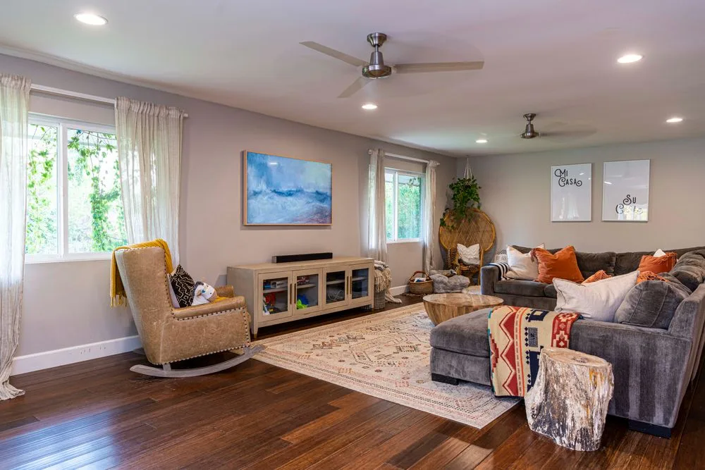 Furnished living room with a sofa and natural light
